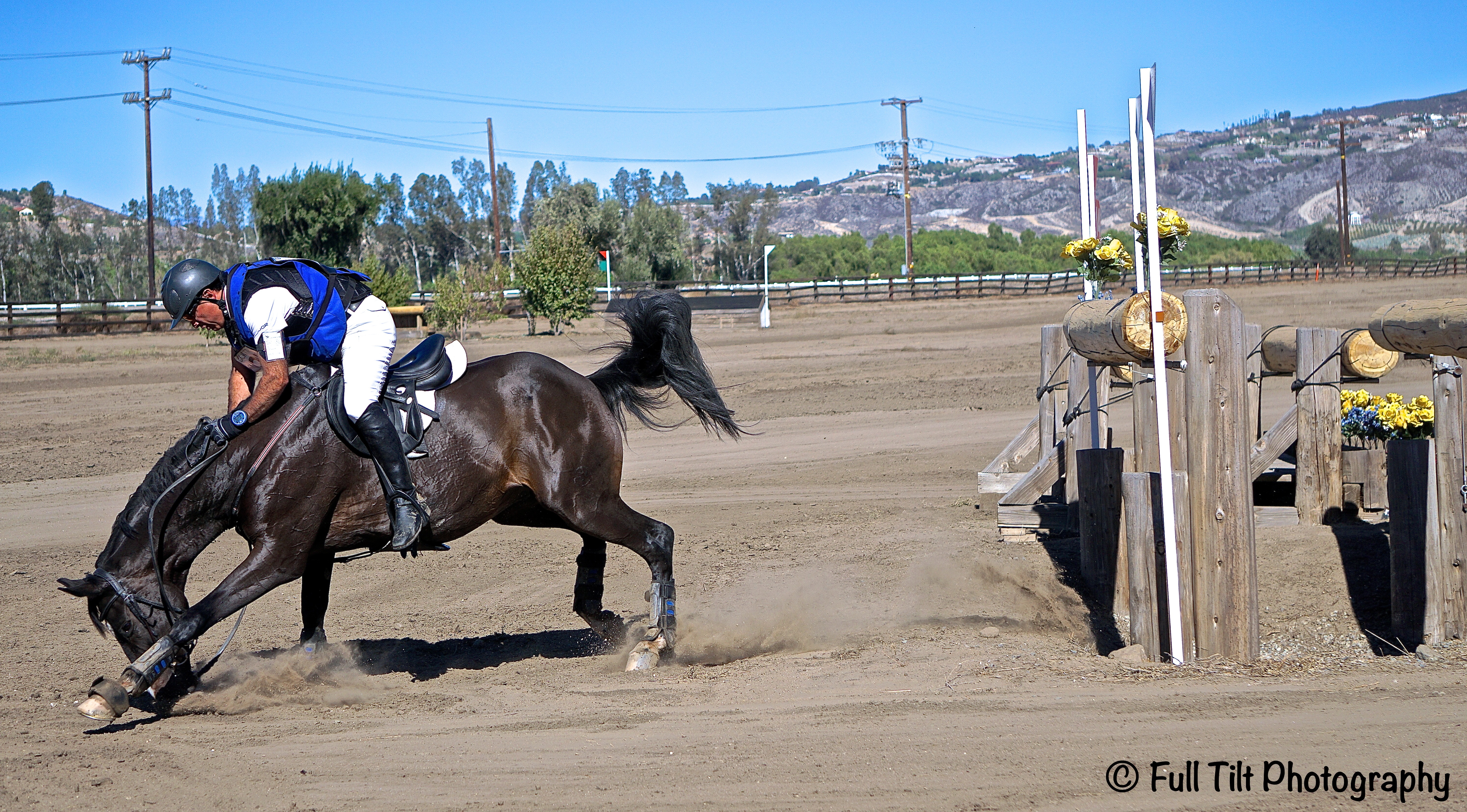 Horse pecking on landing cross country jumping